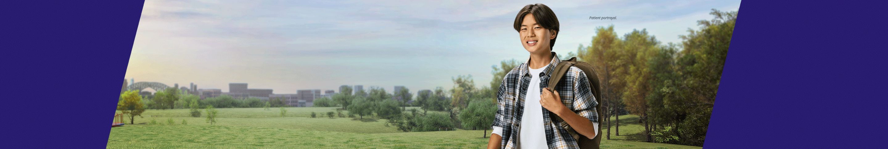 Boy with backpack in school (patient portrayal)